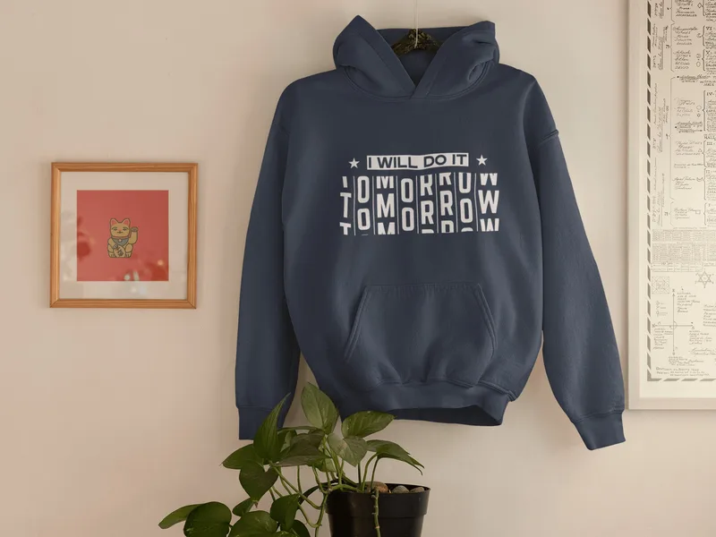 Navy blue hoodie with a white graphic reading I will do it tomorrow, the last word jumbled