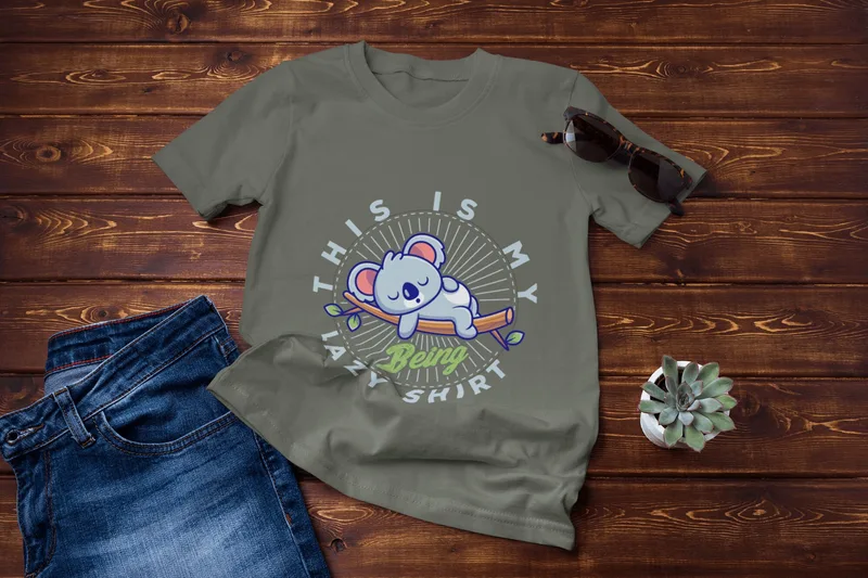 Green t-shirt with a cartoon koala asleep on a branch and the text This is my lazy being shirt