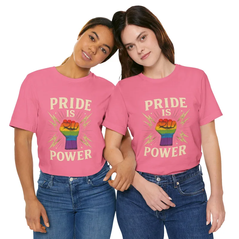 T-shirt printed with a raised rainbow fist and the words Pride Is Power